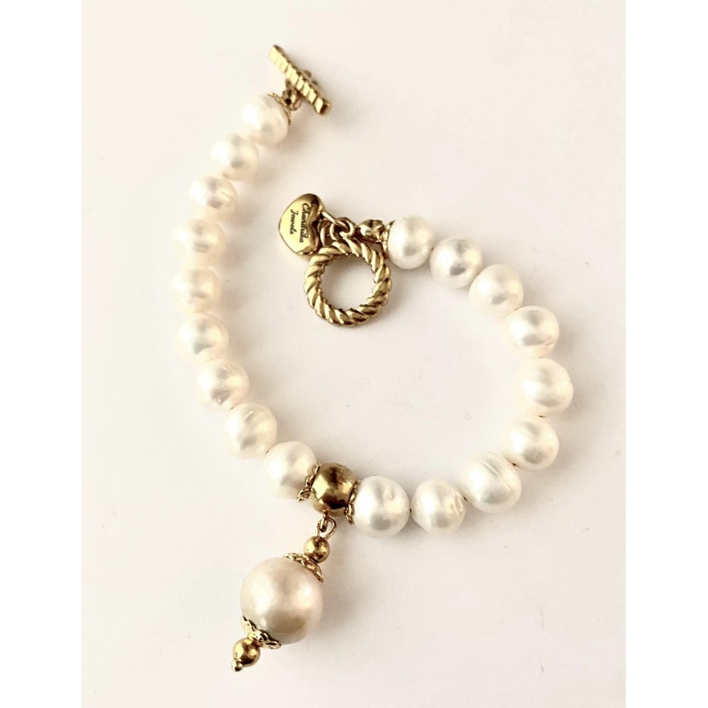 9 mm white freshwater pearl bracelet with barok pearl . Steel/gold