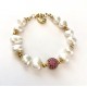 10-11mm white freshwater pearl bracelet. Steel/gold