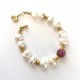 10-11mm white freshwater pearl bracelet. Steel/gold