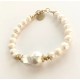 7-8 mm white freshwater pearl bracelet with big barok. Steel/gold