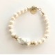 7-8 mm white freshwater pearl bracelet with big barok. Steel/gold